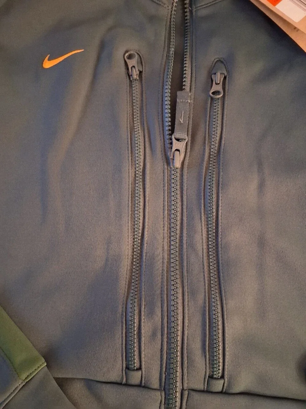Nike Men's Dark Green Full-Zip Performance Jacket with Orange Swoosh
